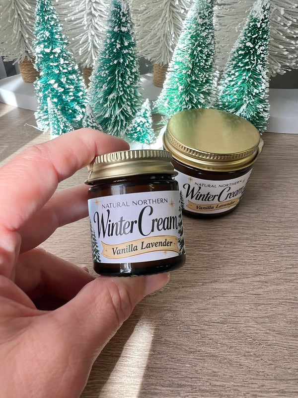 Kim Laureano founder of Natural Northern in Minocqua, WI holding a bestselling Limited Edition 1oz mini amber jar of Winter Cream for dry sensitive skin. 